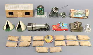 A metal model Bren gun carrier 3", 2 tin plate models of tents 2 1/2", a Corgi Land Rover 109 W.B (wheels f), a Britains model motorcycle no.9692, Continental clockwork tin plate locomotive 5", various sand bags and a small collection of toys 