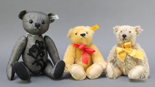 A Steiff grey collectors bear with articulated limbs 11 1/2", a Steiff yellow bear with articulated limbs 9" and a Steiff Classic bear 9 1/2" 