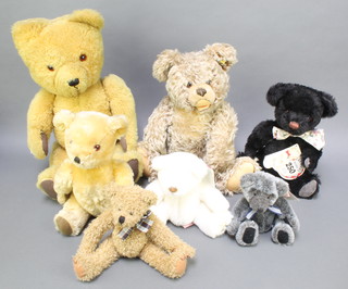 A Steiff teddybear with articulated limbs 16", a Carnival black limited edition teddybear 14", a Grey Russ bear 6", a white ditto and 3 yellow teddybears 