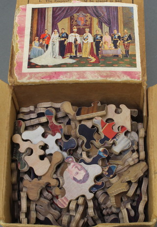 A 1934 Duke of Kent Royal Wedding jigsaw puzzle contained in a cardboard civilian gas mask box 