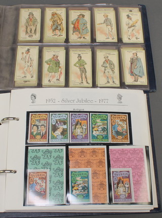 A 1977 Queen's Silver Jubilee album of  Commonwealth presentation stamps - Anguilla, Barbados, etc, together with an album of Players cigarette cards 