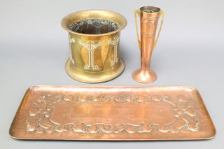 A Newlyn style rectangular embossed copper tray with stylised flower head decoration 23 1/2" x 9 1/2", a ditto waisted vase with brass twin handles the base marked Beldray 10" together with a circular brass jardiniere 8" 