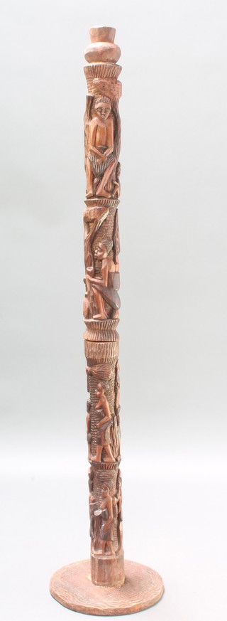 A carved hardwood "Totem" pole 61" 