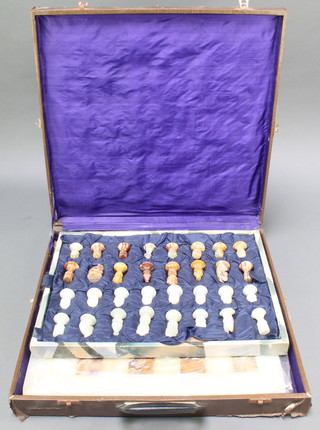 An onyx chess set comprising board and pieces 