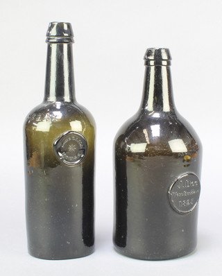 A George IV Doneraile House green glass wine bottle with seal mark and marked patented, the base with inscription 11" and 1 other William IV green glass wine bottle with seal marked J Dee West Buckland 1825 10" 