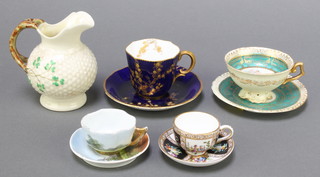 A Belleek cream jug the base with black mark 4"h, a Royal Crown Derby blue and gilt decorated cabinet cup and saucer (slight contact marks to saucer), a miniature Dresden cabinet cup and saucer 1", 2 Continental porcelain cabinet cups and saucers (1 with chip to saucer) 