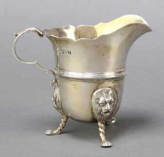 A Georgian style silver cream jug raised on 3 hoof supports, Chester 1911, 138 grams 