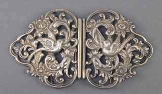 A Victorian cast and pierced silver buckle in the form of doves amongst flowers, London 1897, 94 grams