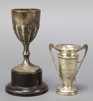 A silver twin handled presentation trophy cup, Birmingham 1925 3",  together with a silver goblet shaped trophy cup Birmingham 1932, 124 grams 

