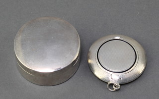 A circular silver rouge pot Birmingham 1919 1 1/2" and a circular silver and enamelled compact marked 925 1 1/2"  