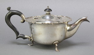 A circular silver teapot Birmingham 1928 with ebony handle, gross weight 358 grams 