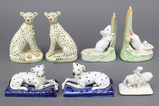 A pair of Brenda Dennis pottery figures of harvest mice with ears of corn 6 1/2", a pair of Miranda C Smith pottery figures of leopards 6", pair of figures of seated Dalmatians on cushions 5" and a biscuit porcelain lid of a match box in the form of a walking tiger with cherub (wings f) 3" 