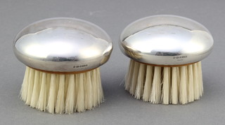 A pair of modern circular silver brushes 2" 