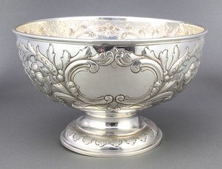An Edwardian repousse silver rose bowl with floral and scroll decoration and vacant cartouche, London 1905 10", 606 grams