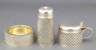 A silver  3 piece condiment with cross hatched decoration comprising gilt lined salt, tapered pepper and lidded mustard, London 1980 by Fennel of London, 392 grams 
