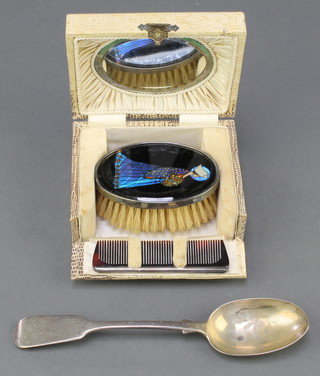 A silver mounted cased brush and comb with butterfly decoration, Birmingham 1927 together with a silver dessert spoon 