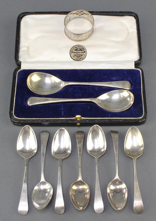 A pair of silver sauce spoons, Sheffield 1923, 7 Georgian silver tea spoons mixed dates and a napkin ring 