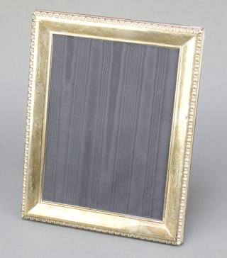 A modern rectangular silver photograph frame 9 3/4" x 7 3/4" 