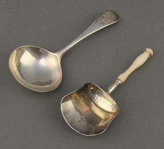 A Georgian silver caddy spoon, a ditto shovel with turned ivory handle 