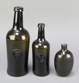 An 18th/19th Century green glass club shaped wine bottle with coronet seal marked P, 1 other club shaped wine bottle with All Souls Common Room seal 8 1/2" together with a an oval shaped green glass bottle 5" 