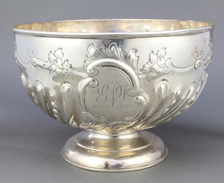 A Victorian repousse silver punch bowl with demi-fluted and scroll decoration, the cartouche engraved 1900/1950 GPF, London 1897, 856 grams, 10 1/4" 