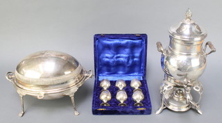 A silver plated oval breakfast dish, a ditto samovar and a cased set of egg cups 