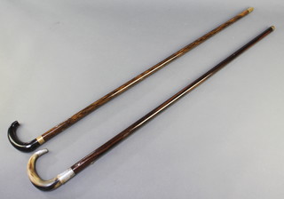 An Edwardian walking cane with horn handle and silver mount and 1 other