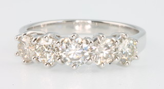An 18ct white gold 5 stone diamond ring, size M