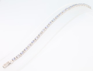 A silver tanzanite and cubic zirconia line bracelet, 170mm 