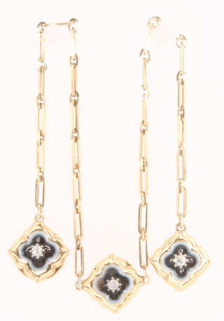 A set of 3 Edwardian yellow gold diamond and enamel studs connected on a yellow gold chain in a fitted case 