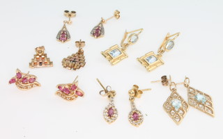 A pair of 18ct yellow gold and gem set earrings and minor earrings