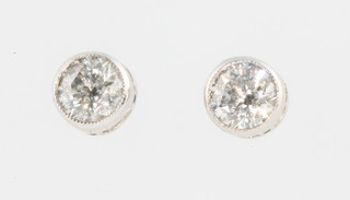 A pair of 18ct white gold rub over setting diamond ear studs approx. 0.8ct 