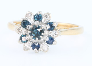 An 18ct yellow gold sapphire and diamond cluster ring size L 