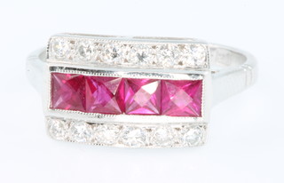 An 18ct white gold ruby and diamond Art Deco style cocktail ring, size M 