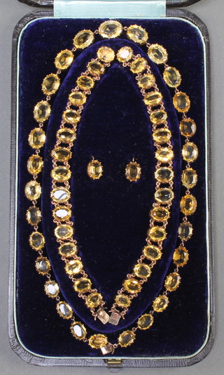 A Victorian gold and citrine set suite of jewellery comprising necklace, 2 bracelets and a pair of earrings, contained in original fitted case