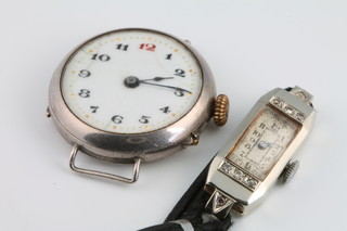 A lady's 18ct white gold diamond cocktail watch on a leather strap, a silver wristwatch 
