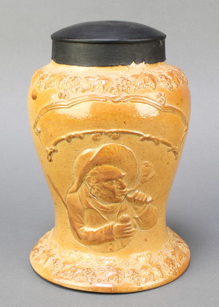 A 19th Century 3 pint salt glazed tobacco jar of waisted form with vinous decoration, decorated a portrait of a gentleman smoking a pipe 9", complete with metal lid  