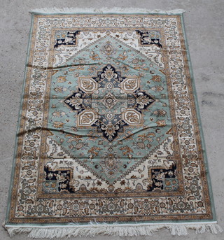 A green and gold ground Belgian cotton Heriz rug with diamond shaped medallion to the centre 76" x 53" 