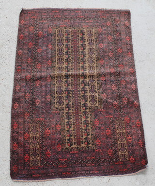 A brown and red Balochi prayer rug 60" x 38", some wear