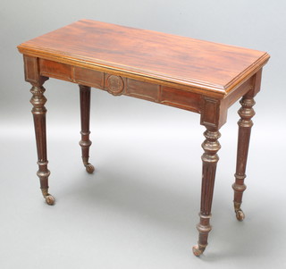 A late Victorian rectangular walnut card table with shaped apron, raised on turned and fluted supports 30"h x 36"w x 18"d