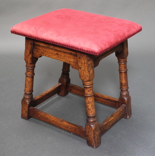 A rectangular oak joined stool raised on turned and block supports 19"h x 18"w x 15 1/2"d 