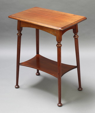 An Edwardian Art Nouveau rectangular mahogany 2 tier occasional table raised on club supports 29"h x 24"w x 16"d 