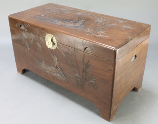 A carved Hong Kong camphor coffer with hinged lid and brass mounts 21"h x 40"w x 19 1/2"d 