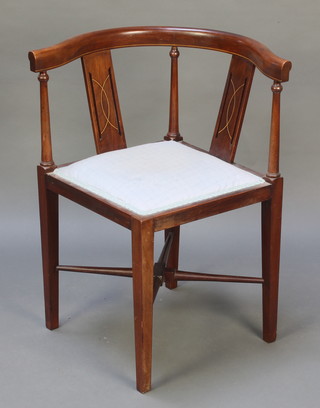 An Edwardian inlaid mahogany slat back corner chair with upholstered seat on square supports with X framed stretcher 