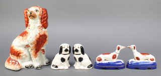 A 19th Century Staffordshire figure of  seated Spaniel 9" (firing crack to tail), 2 Staffordshire style figures of seated greyhounds 5" and 2 ditto black and white Spaniels 4" 