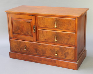 An Edwardian walnut wash stand fitted a cupboard flanked by 2 short drawers above 1 long drawer, raised on a platform base 30 1/2" x 46"w x 19 1/2"d  