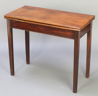 A Georgian rectangular mahogany tea table raised on square tapered supports 28"h x 33 1/2"w x 16"d 
