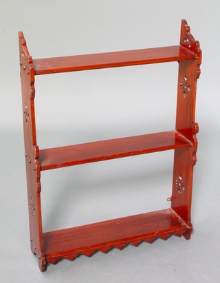 An Edwardian mahogany 3 tier hanging wall shelf with pierced panels to the sides 29"h x 20 1/2"w x 5 1/2"d 