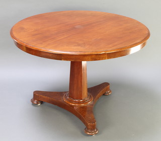 A circular William IV snap top breakfast table, raised on a chamfered column with triform base and bun feet 27"h x 41" diam. 