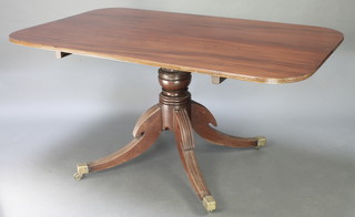 A 19th Century rectangular mahogany breakfast table raised on a turned column, tripod supports, brass caps and casters 29 1/2"h x 60"l x 36"w 